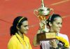 Saina Nehwal poses with the winner's trophy after defeating PV Sindhu in the Syed Modi International India Grand Prix Gold final.