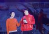 Taufik Hidayat interacts with Fu Haifeng on stage