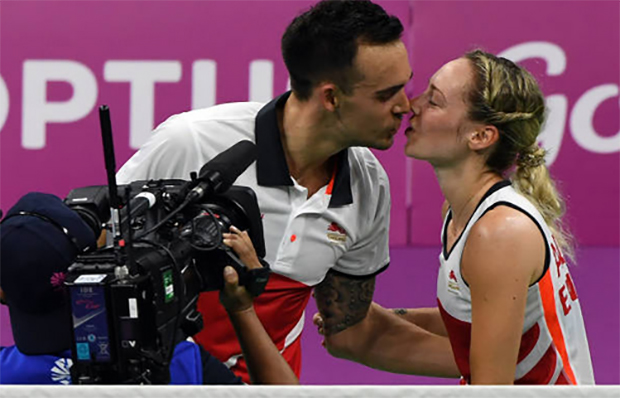 Chris and Gabby Adcock celebrate after successfully defended their mixed doubles gold medal. (photo: AP)