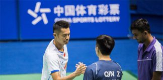 Lin Dan shakes hand with Zheng Qin before the China Masters second round match. (photo: AFP)