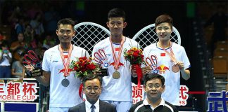 Chen Long (middle) wins his first Badminton Asia Championships in Wuhan on Sunday.