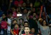 Lee Chong Wei uses a selfie stick to take photos. (photo: GettyImages)