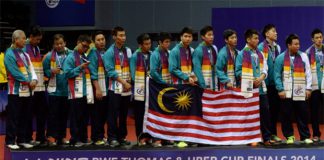 Members of the Malaysia men's badminton team pose on the podium as runners-up following a 2-3 defeat to Japan in the 2014 Thomas Cup final. (photo: GettyImages)