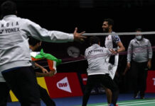 Teammates rush to the court after HS Prannoy scores the winning point to give India a 3-2 victory against Denmark in the 2022 Thomas Cup semi-final. (photo: Shi Tang/Getty Images)