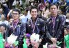 Mohammad Ahsan (left) and Hendra-Setiawan (right) don't look happy in the Sudirman Cup award ceremonies. (photo: PBSI)