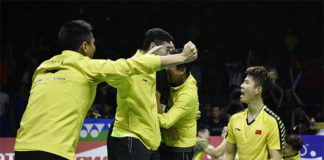 Chinese players storm the court after the Li Junhui/Liu Yuchen clinch the winning point for China. (photo: AP)