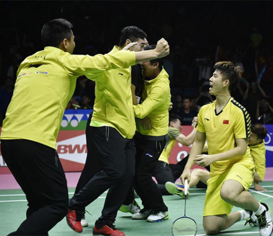 Chinese players storm the court after the Li Junhui/Liu Yuchen clinch the winning point for China. (photo: AP)