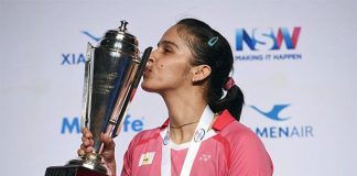 Saina Nehwal kisses the trophy after winning the Australian Open women's singles final. (photo: AFP)