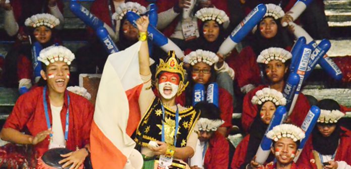 Indonesian badminton fans with their colourful and creative outfits