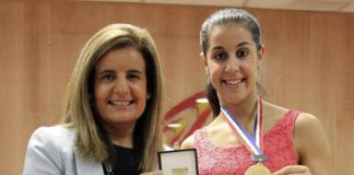 Spanish Minister Fatima Banez (L) delivers the Sport Merit Royal Order to Carolina Marin on September 2, 2014 in Madrid, Spain.