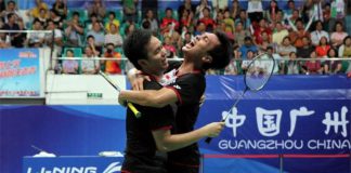 Mohammad Ahsan (right) and partner Hendra Setiawan celebrate after winning the 2013 men's doubles world championships